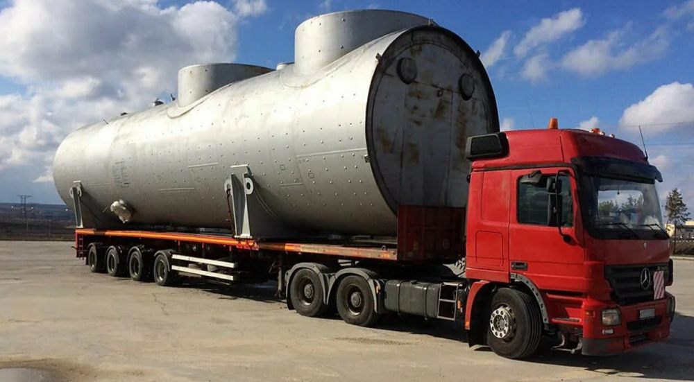 Перевозка негабаритных емкостей и цистерн на трале стоимость услуг и где заказать - Биробиджан